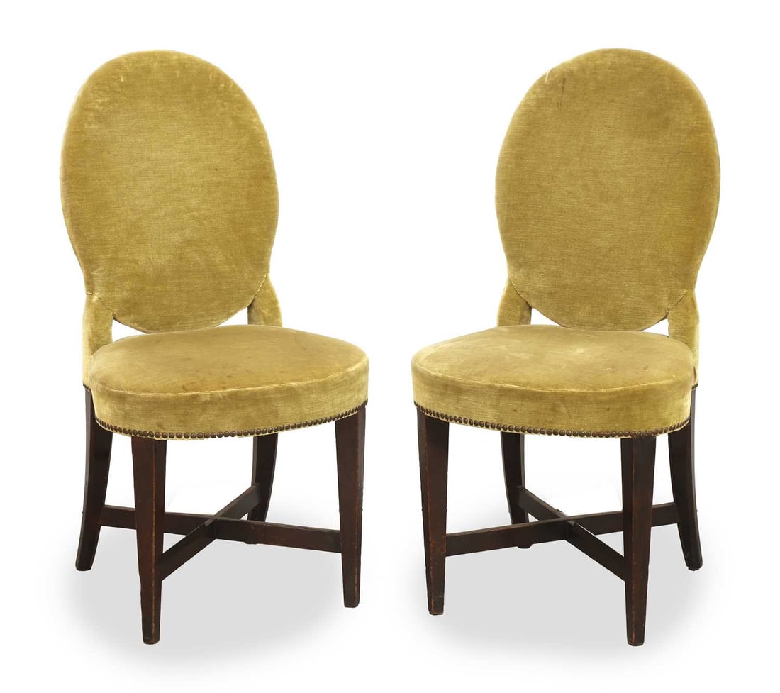A pair of green velvet dining chairs, late 19th century,: A pair of green velvet dining chairs, late 19th century, the oval back upon brass studded seat, over square tapering crossbanded supports 48cm wide, 93cm high,