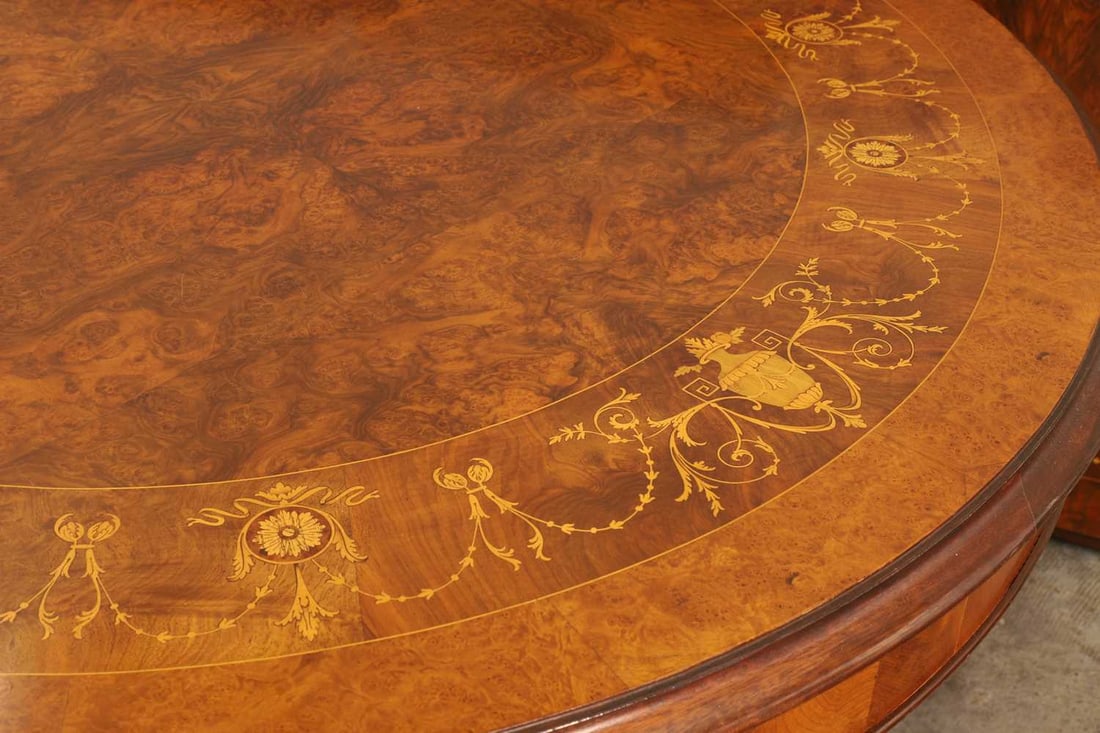 An inlaid walnut extending dining table, - 3