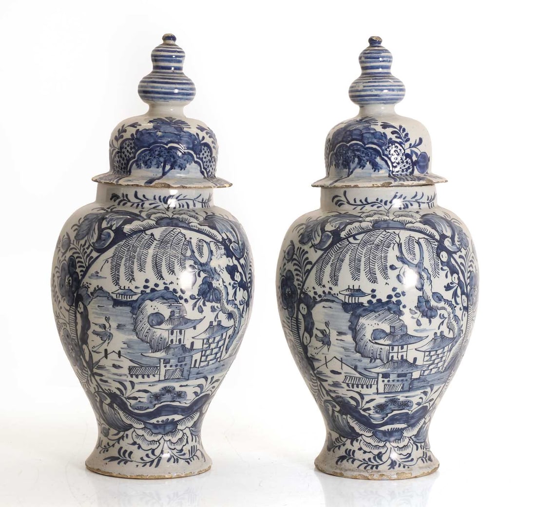 A pair of Dutch Delft blue and white baluster vases and covers, probably late 18th century, - 2
