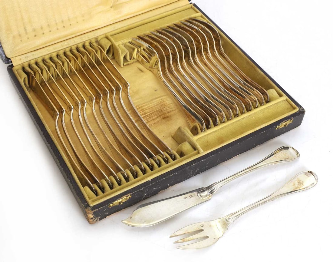 A cased set of twelve continental fish knives and forks, 19th/20th century, - 2