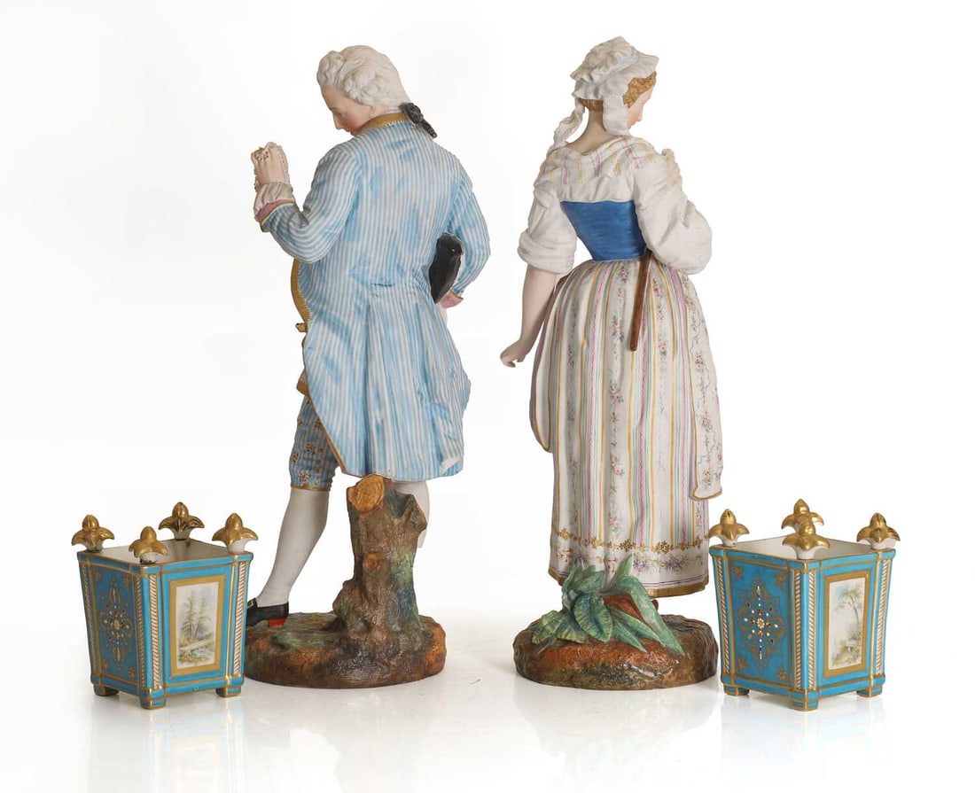 A pair of Continental bisque figures of a gentleman and a lady, late 19th century, - 2