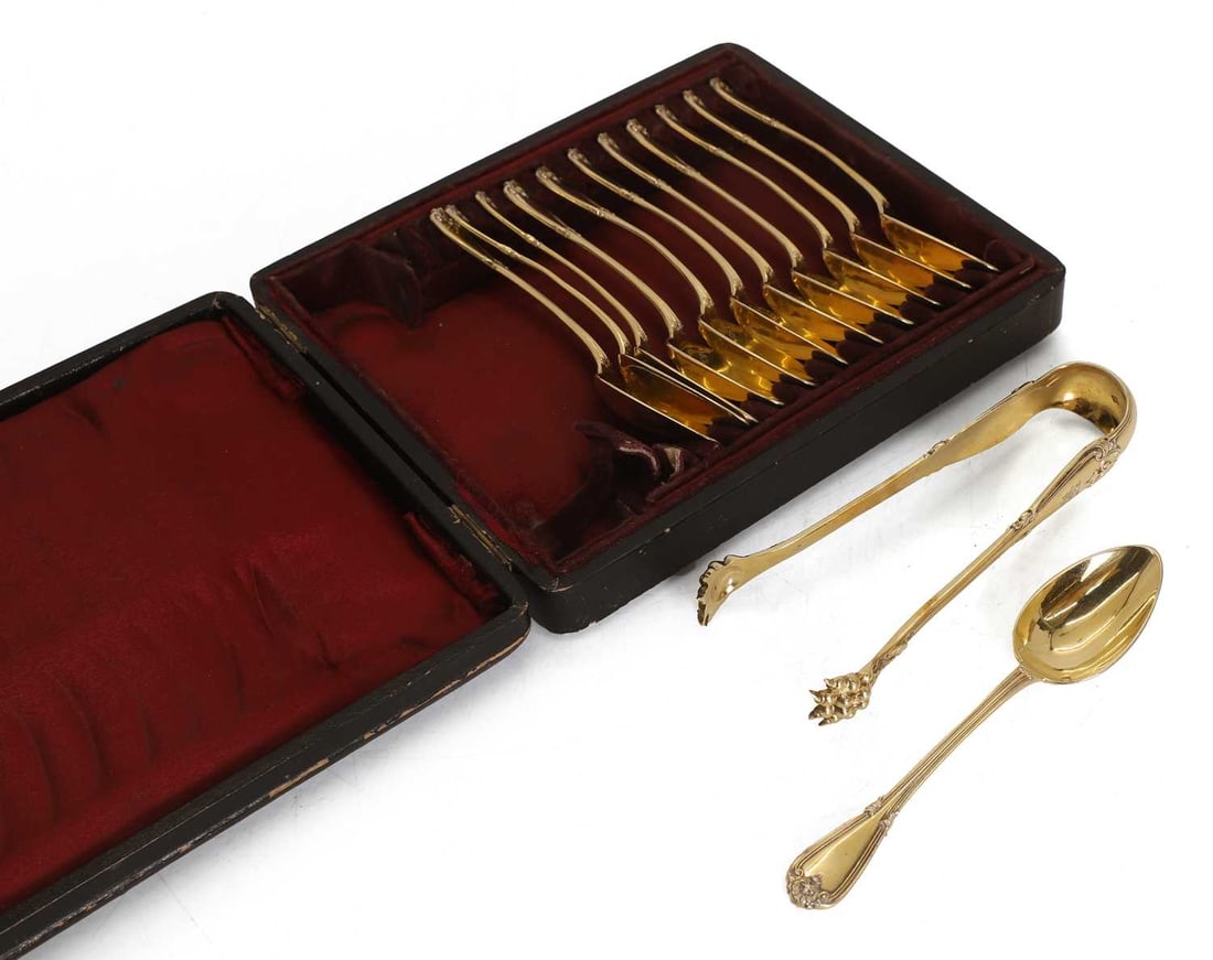 A cased set of twelve spoons and a pair of tongs, late 19th century, - 2