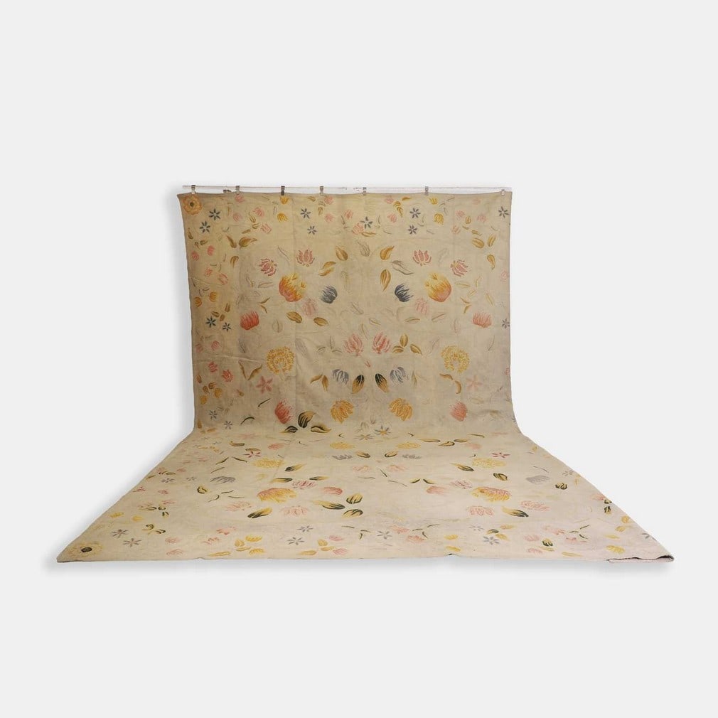 Art Nouveau, a hand-stitched rug,: Art Nouveau, a hand-stitched rug, early 20th century, decorated with multicoloured floral motifs to a cream ground (530 x 375cm)