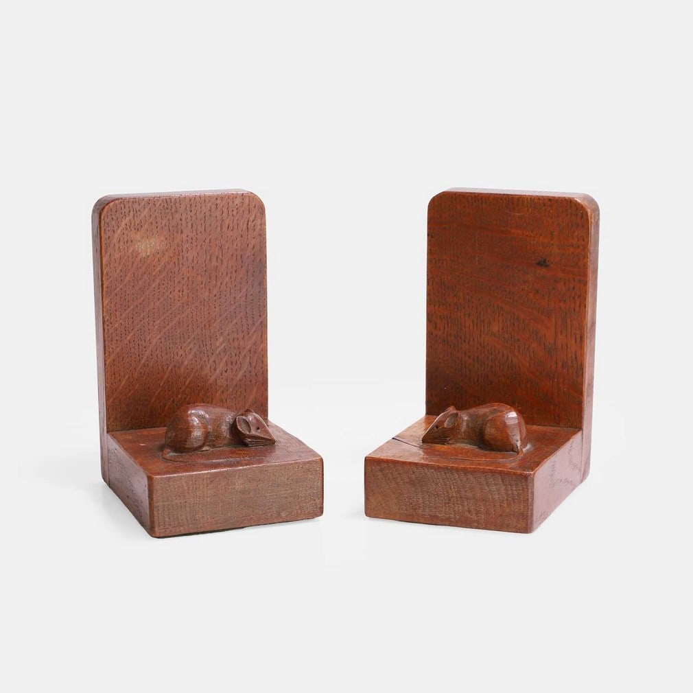 Robert 'Mouseman' Thompson (British, 1876-1955), a pair of oak bookends,: Robert 'Mouseman' Thompson (British, 1876-1955), a pair of oak bookends, circa 1930, each with a carved mouse signature (11.5cm wide, 8.5cm deep, 15.3cm high) (2) Condition Report: Structurally, the