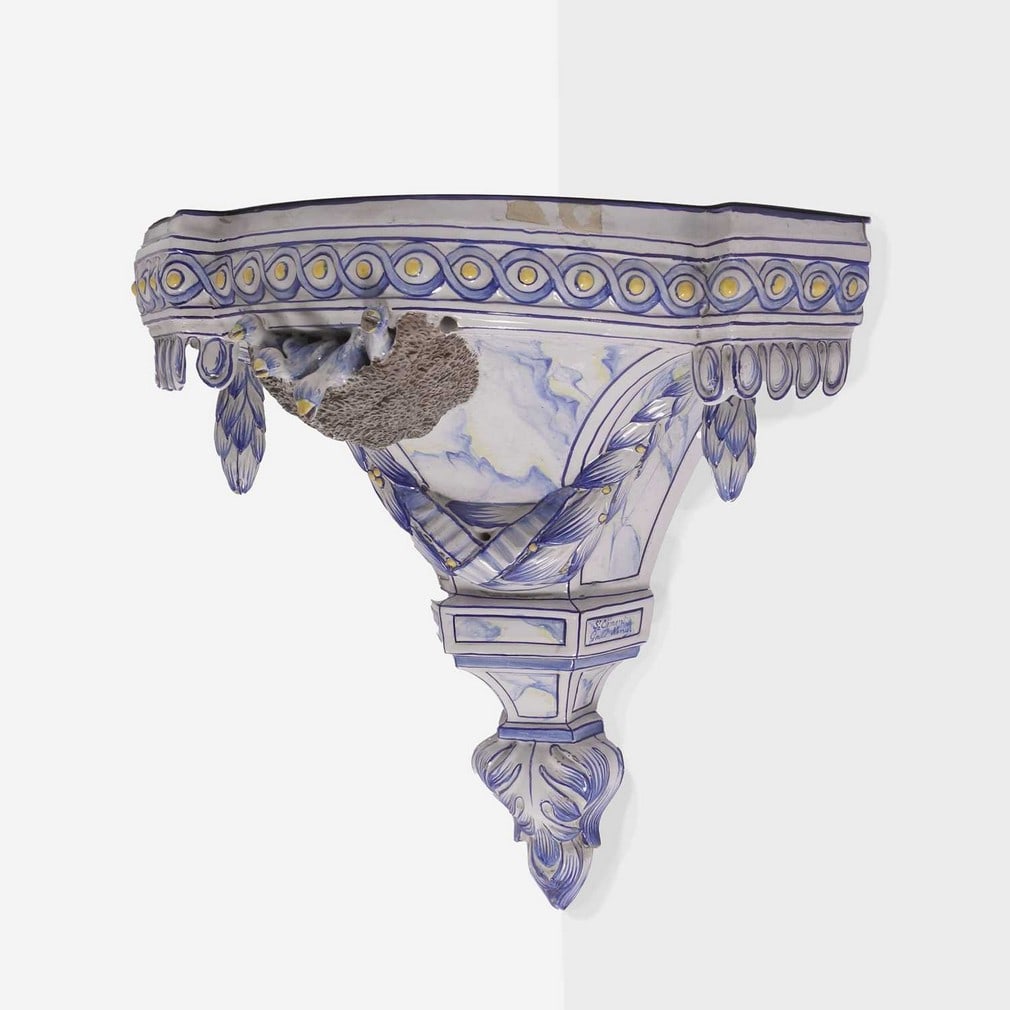 Émile Gallé (French, 1846-1904) for St Clément, a faience 'Bird's Nest' wall sconce,: Émile Gallé (French, 1846-1904) for St Clément, a faience 'Bird's Nest' wall sconce, 19th century, of vaulted form, decorated with blue and white glaze, with garlands in relief and a