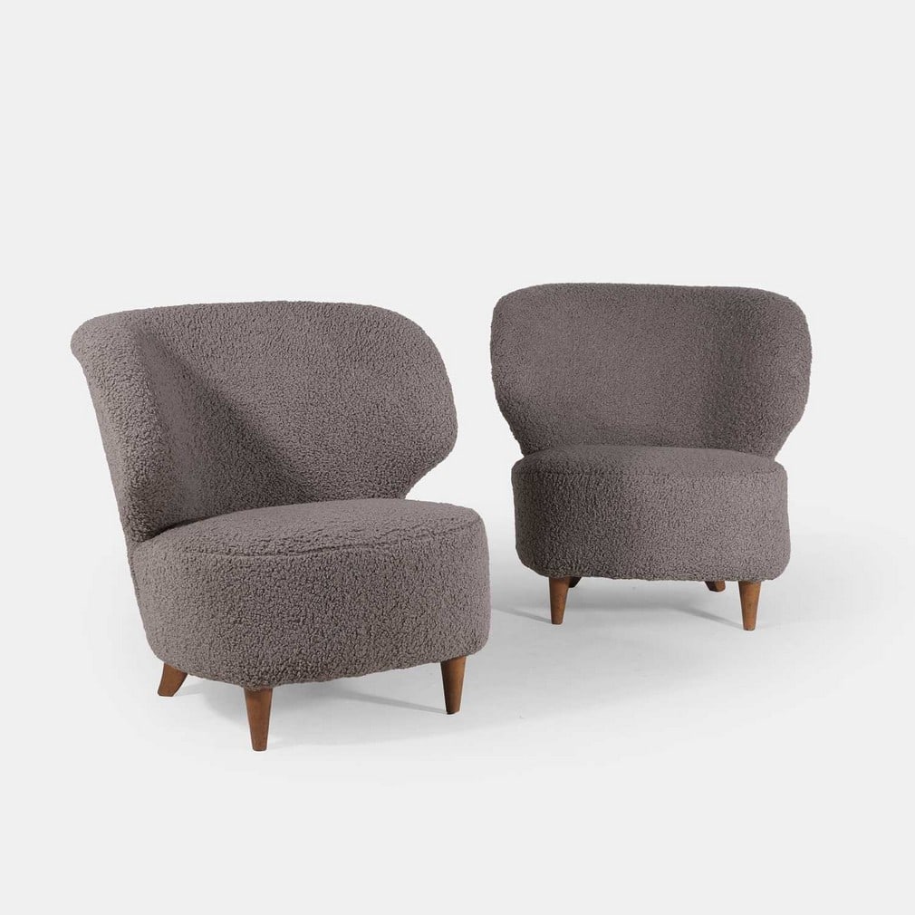 ▲ Carl-Johan Boman (Finnish, 1883-1969) for Oy Boman Ab, a pair of armchairs,: ▲ Carl-Johan Boman (Finnish, 1883-1969) for Oy Boman Ab, a pair of armchairs, circa 1940s, later upholstered in grey bouclé fabric, each curved back over a rounded seat, raised on four tape