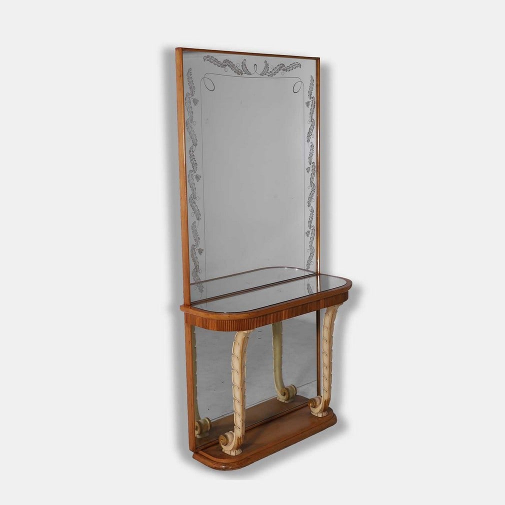 Osvaldo Borsani (Italian, 1911-1985), a walnut console mirror,: Osvaldo Borsani (Italian, 1911-1985), a walnut console mirror, circa 1950s, the rectangular full-length mirror with silvered foliate motif border, with an integrated mirrored top console table with cu