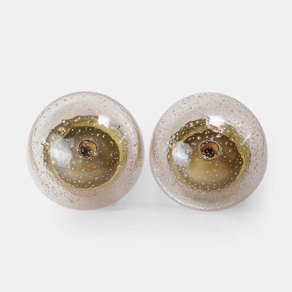 German, a pair of ceiling lights,: German, a pair of ceiling lights, circa 1960s, likely manufactured by either Hillebrand or Limburg, each domed glass shade with gold leaf flecks, over matte-finish gold-tone mounts (24cm diameter,