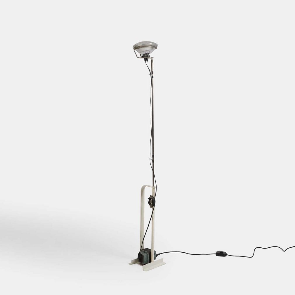 Achille (Italian, 1918-2002) and Pier Giacomo Castiglioni (Italian, 1913-1968) for Flos, a 'Toio': Achille (Italian, 1918-2002) and Pier Giacomo Castiglioni (Italian, 1913-1968) for Flos, a 'Toio' floor lamp, originally designed in 1962, the car headlight raised on a metal stem and a white painted-
