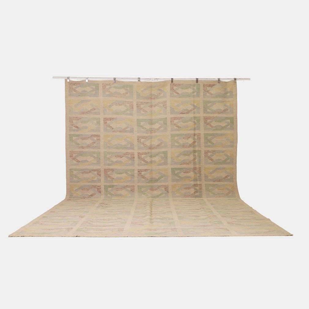Mid-century Scandinavian-inspired, a flat-weave wool kilim,: Mid-century Scandinavian-inspired, a flat-weave wool kilim, of recent manufacture, decorated with a geometric interwoven pattern in blue, green, yellow and brown pastel tones to a cream ground (426 x