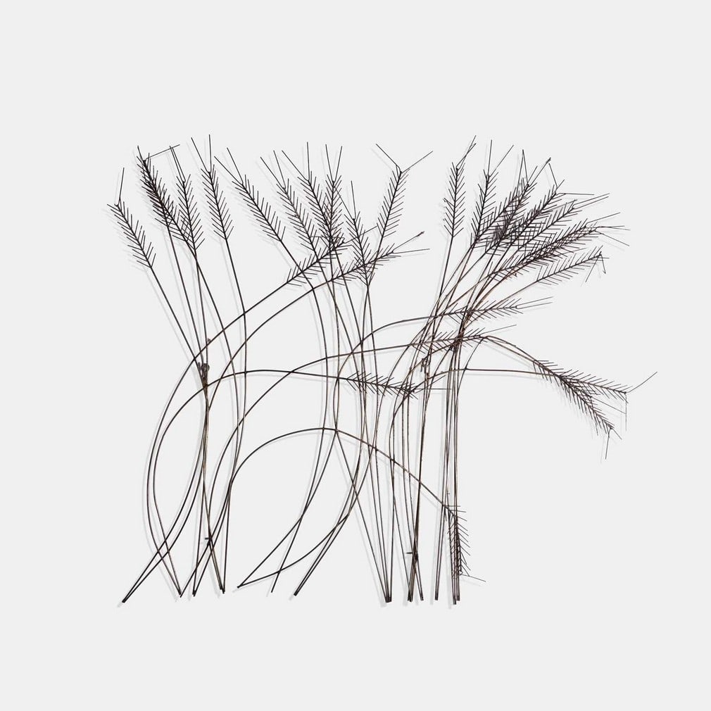 Curtis Jeré, a metal wall sculpture,: Curtis Jeré, a metal wall sculpture, in the form of wheat (104cm wide, 17cm deep, 96cm high)