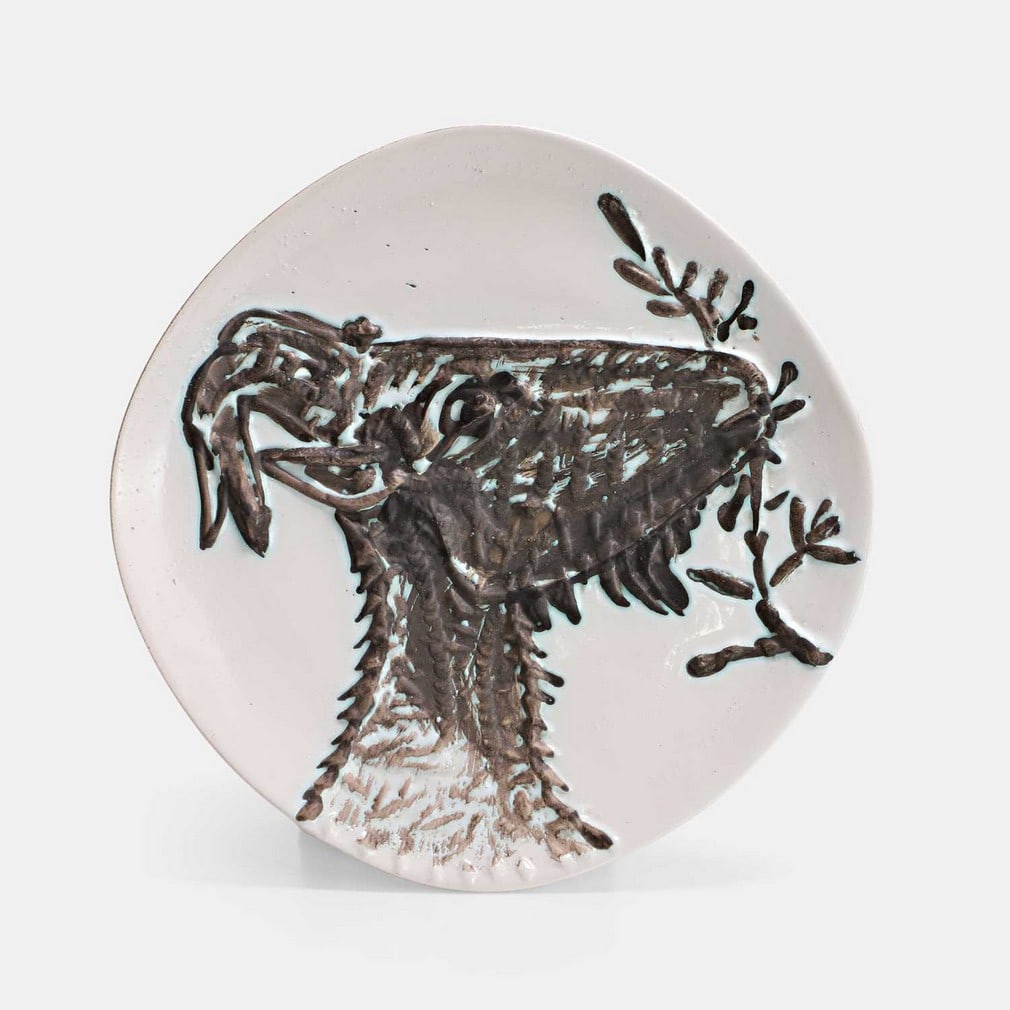 ▲ Pablo Picasso (Spanish, 1881-1973), a 'Tête de chèvre de profil' (AR111) plate,: ▲ Pablo Picasso (Spanish, 1881-1973), a 'Tête de chèvre de profil' (AR111) plate, 1950, earthenware with oxidised paraffin decoration, stamped and numbered 'Madoura Plein Feu, Empreint