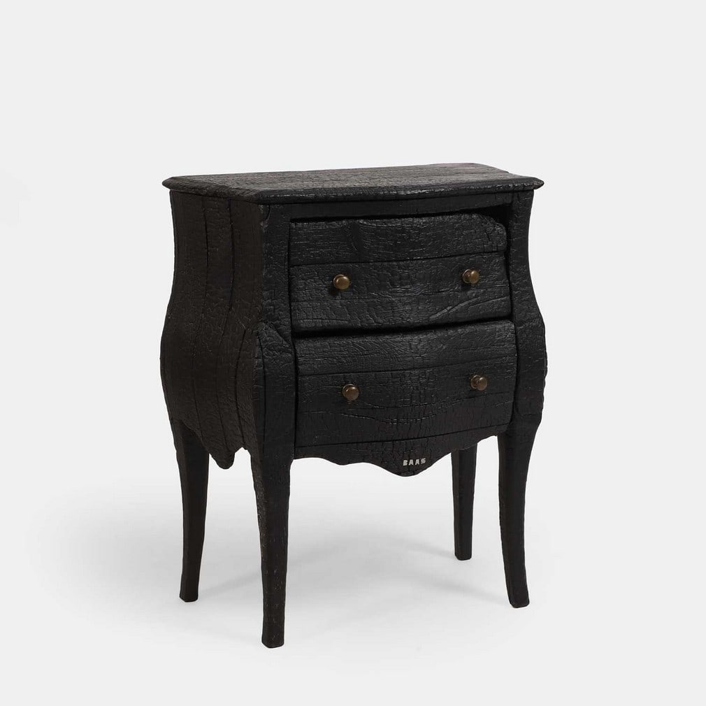 ▲ Maarten Baas (Dutch, b.1978), a 'Smoke' chest of drawers,: ▲ Maarten Baas (Dutch, b.1978), a 'Smoke' chest of drawers, 2004, of bombé form, the wooden frame burnt and coated in epoxy resin, with two graduated drawers, each with ormolu handles,