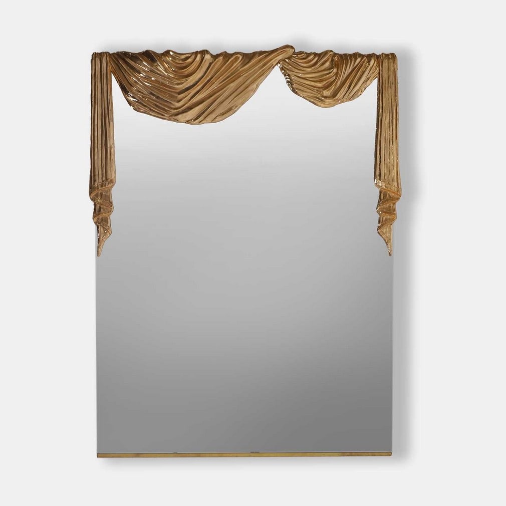 Contemporary, a wall mirror,: Contemporary, a wall mirror, of recent manufacture, the mirror with a gilt-brass half frame stylised as a piece of draped material with a backlight (76cm wide, 100cm high) Provenance: Private collecti