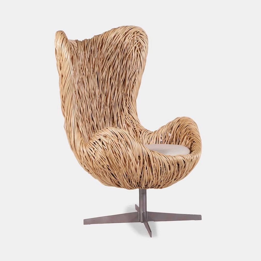 Cherry Chung (British, contemporary) for Quest TV, an 'Egg'-style chair,: Cherry Chung (British, contemporary) for Quest TV, an 'Egg'-style chair, 2023, in the manner of Arne Jacobsen, the woven wickerwork supported by a metal frame, with a cream pile seat pad (79cm wide, 8