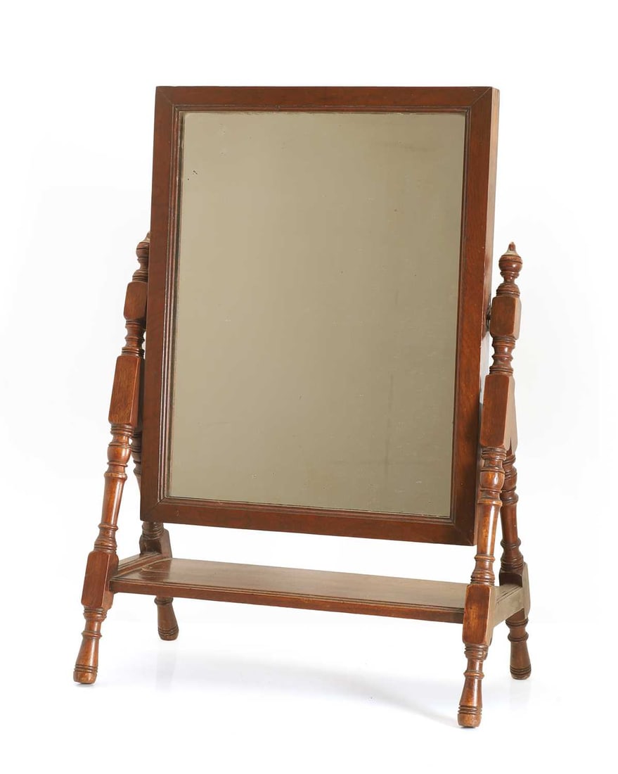 A Shoolbred & Co table mirror, 20th century,: A Shoolbred & Co table mirror, 20th century, stamped to the underside of the mirror, with turned legs united by a platform stretcher 47cm wide, 25cm deep, 68cm high Condition Report: Some light