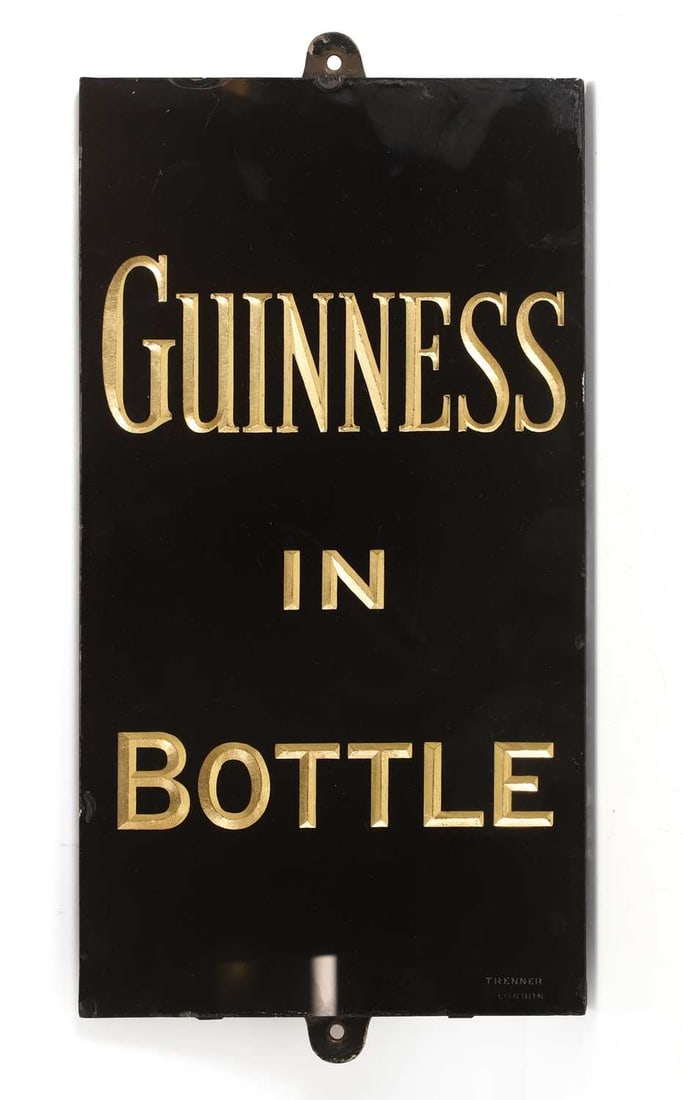 A Guinness advertising plaque, 20th century,: A Guinness advertising plaque, 20th century, the glass plate inscribed ‘Guinness in Bottle’ in gilded font, stamped to the front 'TRENNER LONDON' 28cm wide, 57cm high Condition Report: