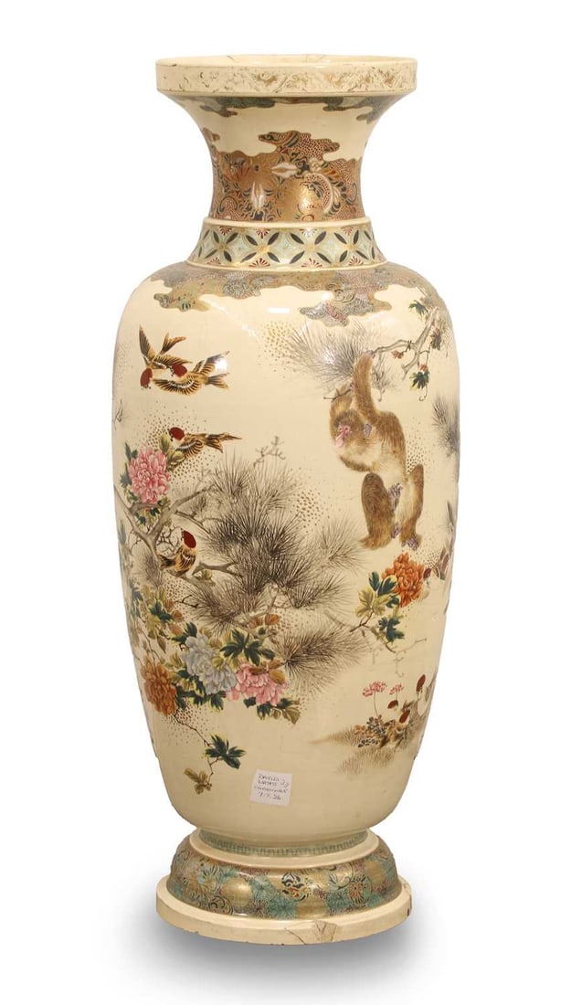 A large Japanese vase,: A large Japanese vase, decorated with monkeys in a blossoming tree 32cm wide, 85cm high Condition Report: Large chips and repair to the base. Crazing to the glaze throughout. Some loss to the