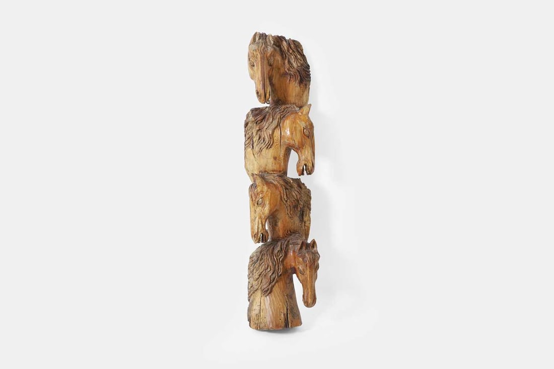 A carved pitch pine appliqué, late 19th century, Spanish or Italian,: A carved pitch pine appliqué, late 19th century, Spanish or Italian, modelled as four horse heads 40cm wide, 28cm deep, 158cm high Condition Report: Some historic splits, knocks and losses