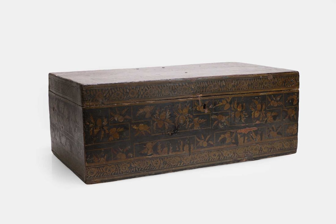 An Anglo-Indian lacquered chest, 19th century,: An Anglo-Indian lacquered chest, 19th century, with a hinged lid, decorated all over with gilded floral motifs to a black ground 64cm wide, 36cm deep, 25cm high Condition Report: General wear