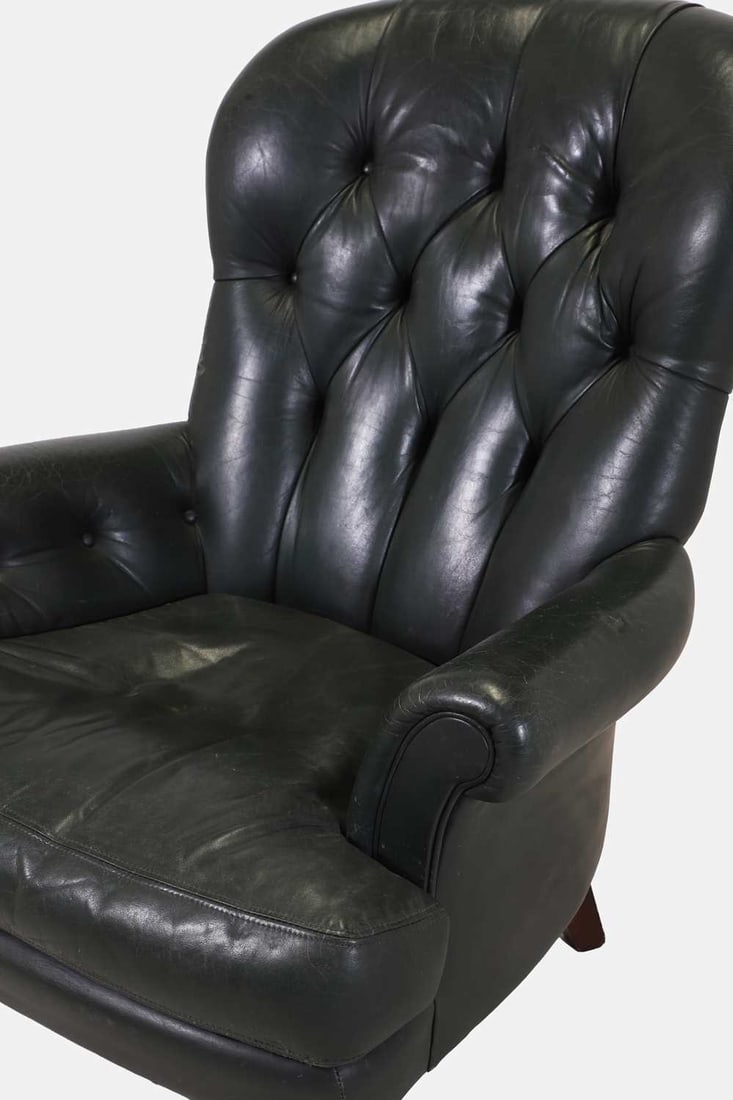 A leather club armchair, 20th century, - 2