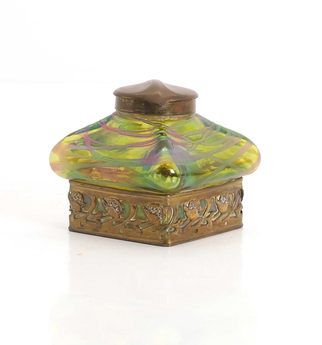 An Art Nouveau Austrian glass inkwell, 20th century,: An Art Nouveau Austrian glass inkwell, 20th century, the main body with a lustre design and brass metal mounts 8.5cm wide, 8cm high