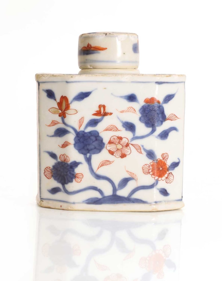 A Chinese Imari tea caddy and cover, 18th century,: A Chinese Imari tea caddy and cover, 18th century, the rectangular body with faceted sides and painted with flowering foliage in underglaze blue, iron-red enamel and gilt 10cm wide, 11.5cm high Condit