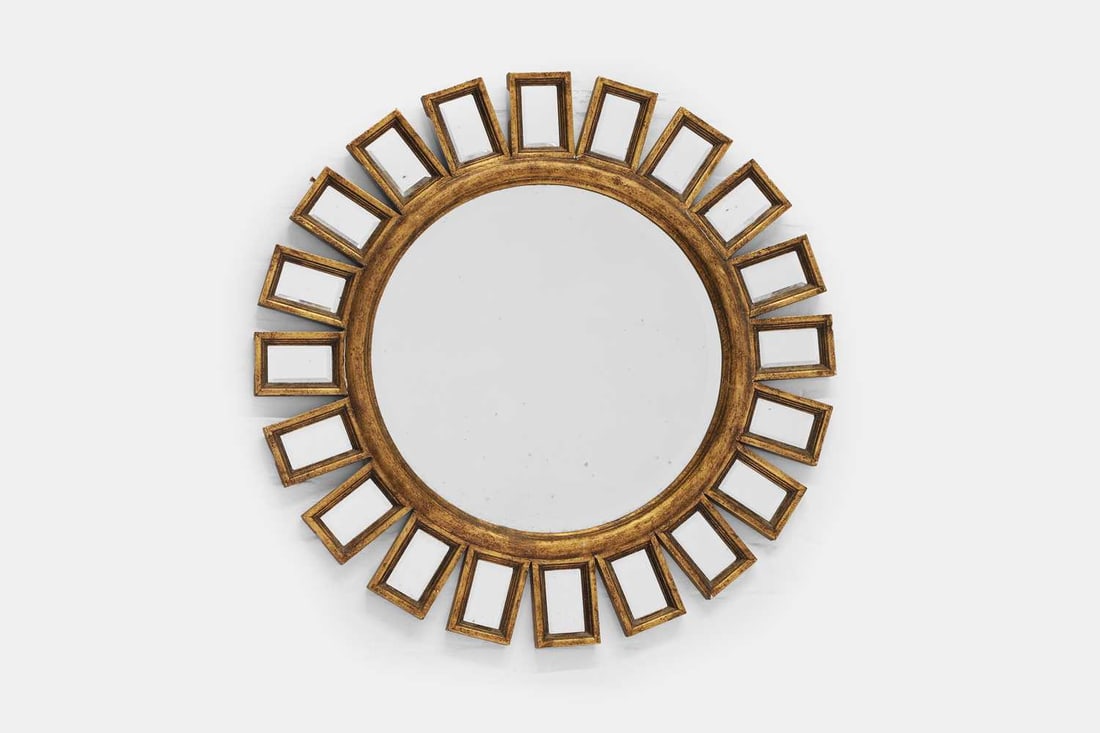 A sunburst wall mirror, of recent manufacture,: A sunburst wall mirror, of recent manufacture, the central circular mirror plate surrounded by rectangular margin plates, all enclosed within gilded frames 85cm wide, 3.5cm deep, 85cm high