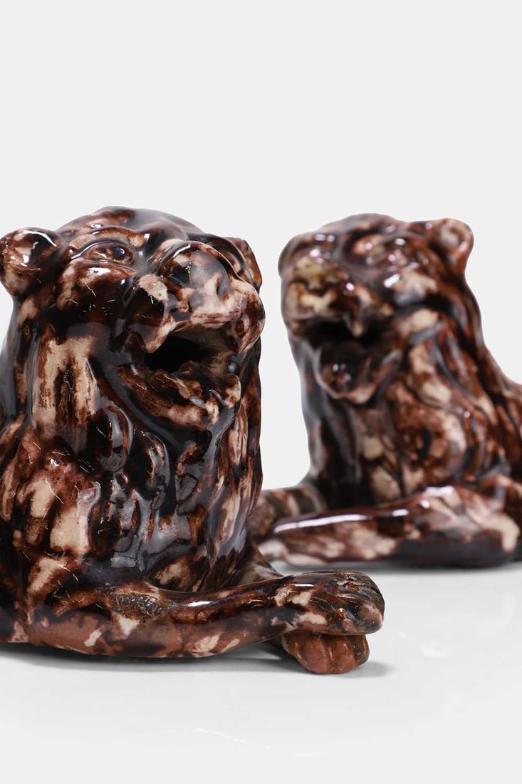 A pair of Whieldon-type pottery lions, second half of the 18th century, - 2