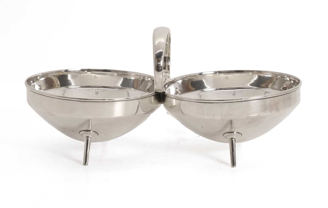 Christopher Dresser for Hukin & Heath, a silver plated bon bon dish,: Christopher Dresser for Hukin & Heath, a silver plated bon bon dish, formed of two circular reserves with a central carrying handle 27cm wide, 14cm deep, 12cm high