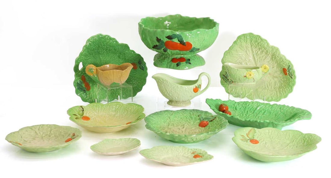 A collection of Carlton Ware ceramics,: A collection of Carlton Ware ceramics, to include twelve leaf moulded bowls decorated with orange fruits, additional plates, sauce boats, etc., all with stamped maker's marks to the bases Plate, 21cm