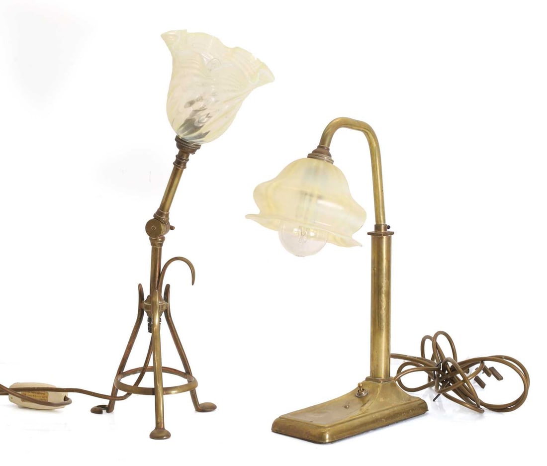 An Arts & Crafts brass and opalescent glass lamp, circa 1900,: An Arts & Crafts brass and opalescent glass lamp, circa 1900, in the manner of WAS Benson, terminating on a rectangular base, together with another similar wall-mounted example 20cm wide, 38.5cm high