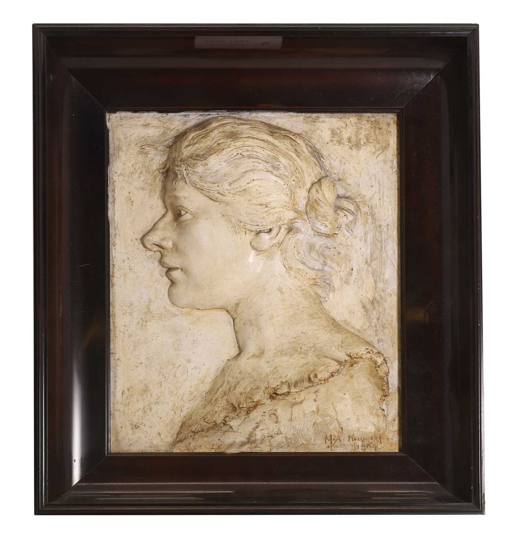 A framed plaster plaque,: A framed plaster plaque, depicting a bust of a lady facing sinister, signed l.r. 'M.A.Ko***dy?' and dated 1904 44.5cm wide, 11cm deep, 51.2cm high