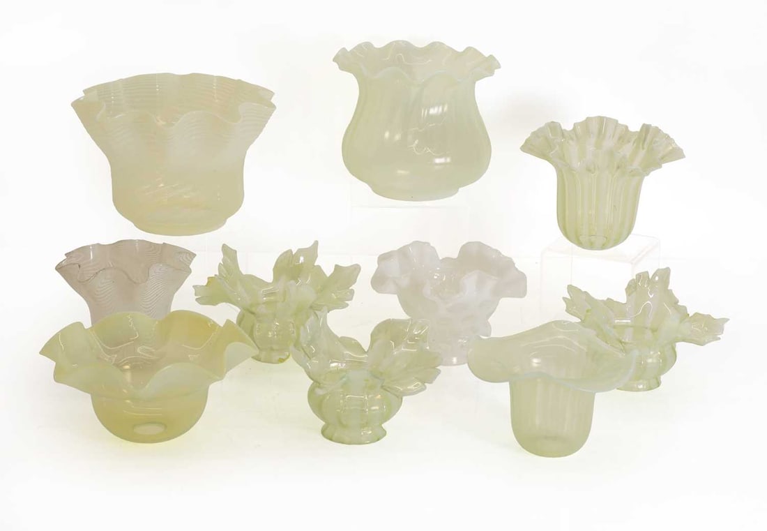 A collection of opalescent glass lighting shades, late 19th century,: A collection of opalescent glass lighting shades, late 19th century, of varying forms, most with striped decoration and fluted rims The largest, 22cm wide, 15cm high (qty.)