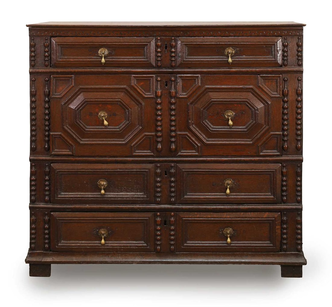 A Charles II oak chest of drawers, late 17th century,: A Charles II oak chest of drawers, late 17th century, with an arragemnet of four drawers, each with geometric moulding, terminating on square feet 101.5cm wide, 55.5cm deep, 94.5cm high Condition