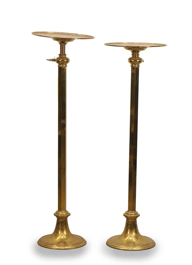A pair of brass telescopic plinths, 19th century,: A pair of brass telescopic plinths, 19th century, in the ecclesiastical manner, with a dished top, both terminating on stepped circular bases 30.5cm wide, 96.5cm high 2 Condition Report: Some