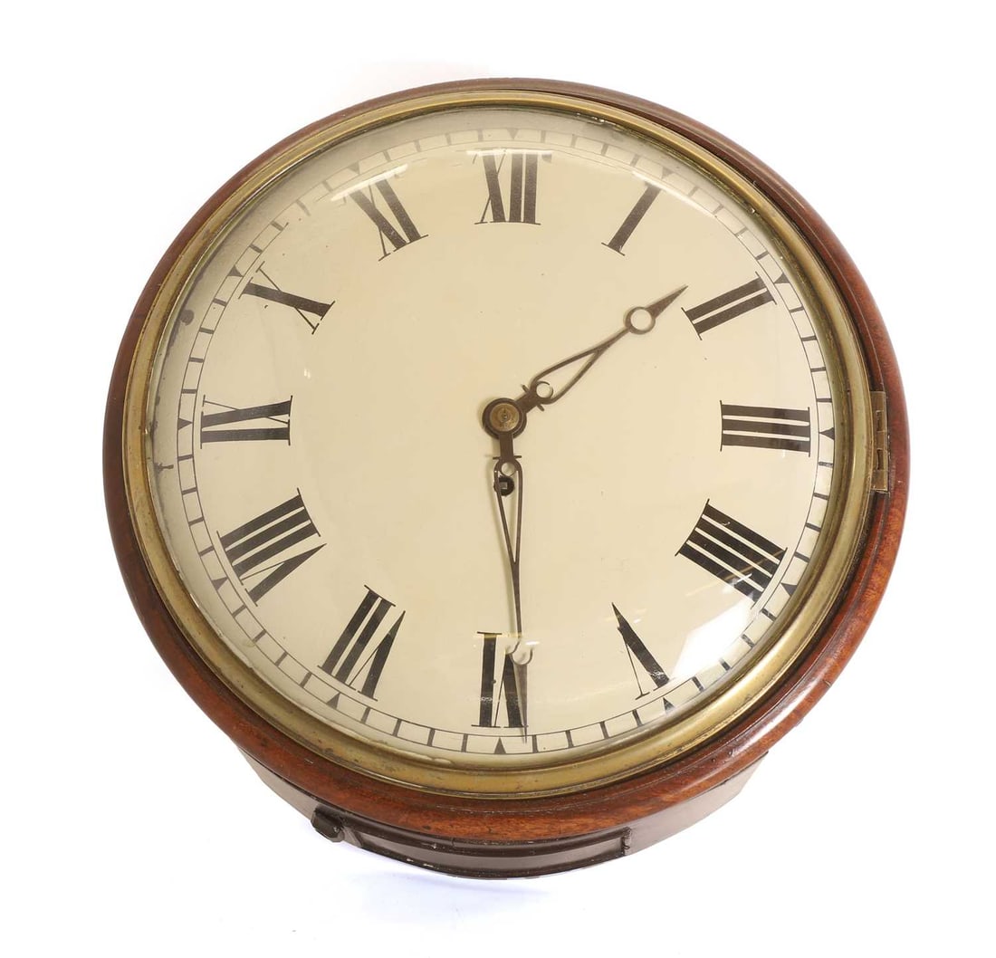 A mahogany dial clock with a white dial, early 19th century,: A mahogany dial clock with a white dial, early 19th century, unsigned, with shaped hands, and a Roman chapter ring, with convex glazed door, fusee movement 36cm wide, 15cm high Condition Report: