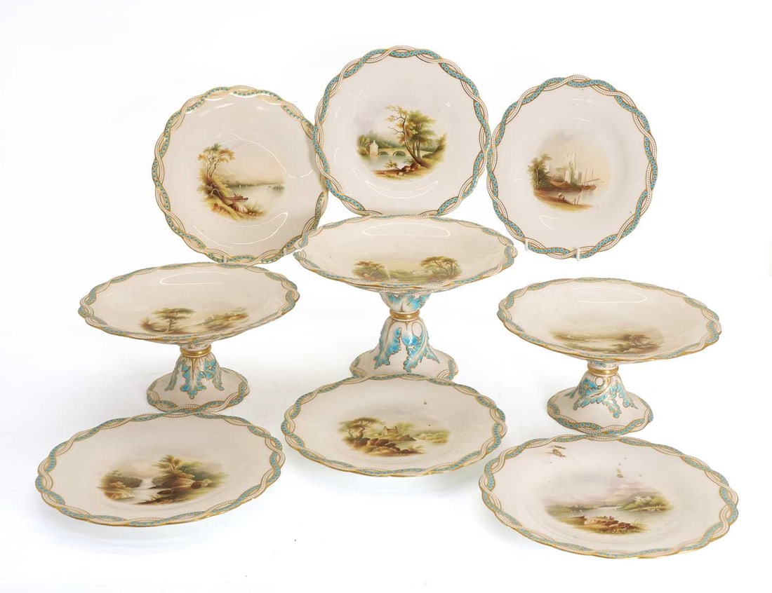 A set of six porcelain Minton plates, circa 1860,: A set of six porcelain Minton plates, circa 1860, with painted landscape reserves, together with three tazzas, all with blue and gilt twisted banded borders, impressed marks to the bases Plates, 23cm