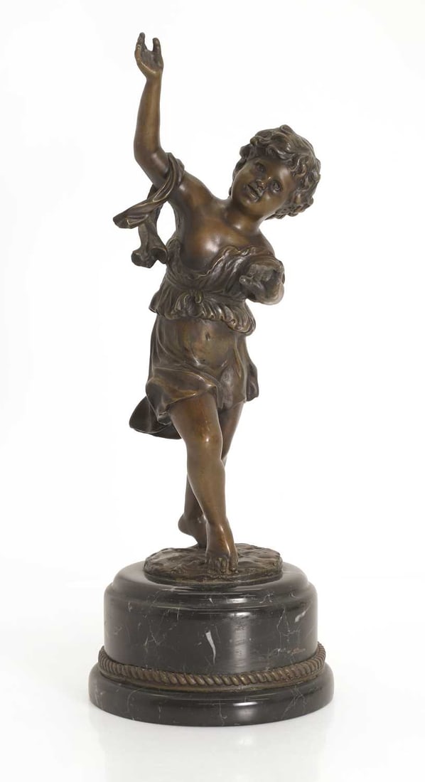 A bronze figure of a putti, 20th century,: A bronze figure of a putti, 20th century, on a stepped black veined marble base, the putti modelled in a dress with hands raised 14cm wide, 40cm high Condition Report: Marks and residue of labels to
