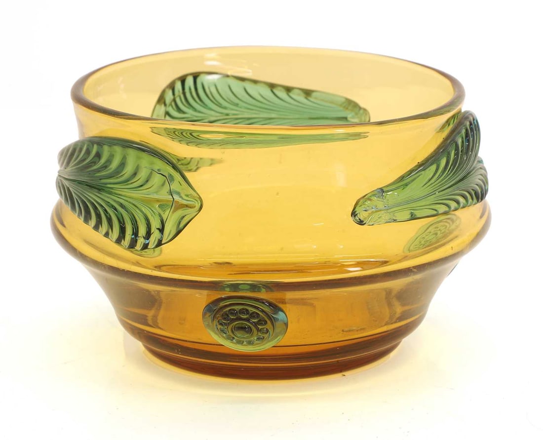 A Bohemian glass bowl, mid 20th century, Czech,: A Bohemian glass bowl, mid 20th century, Czech, possibly designed by Josef Hospodka for Prachen, with applied stylised leaves and roundels 17cm diameter, 11cm high