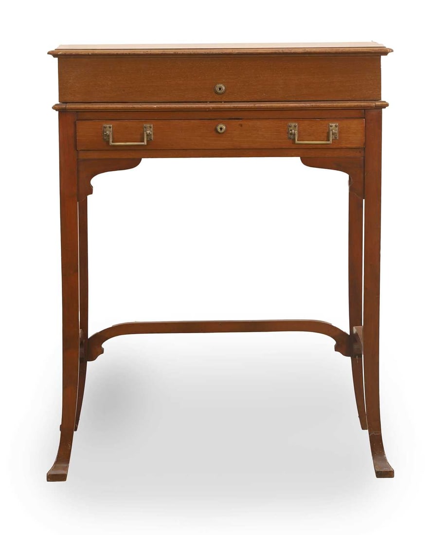 A mahogany writing desk, circa 1900,: A mahogany writing desk, circa 1900, the hinged top, fitted and leather mounted with a hinged letter rack, centred with a silver-plated pocket watch, two slides from Month and Day cards, flanked with