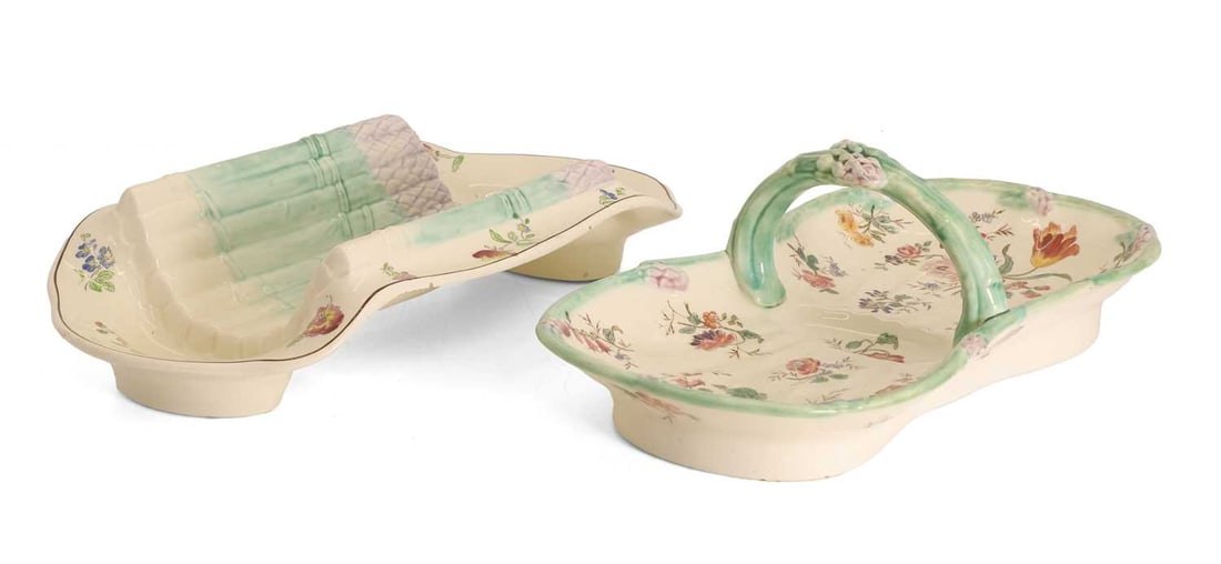 A longchamp Majolica asparagus basket, 19th century,: A longchamp Majolica asparagus basket, 19th century, with handle, together with a 19th century majolica asparagus footed server, both with asparagus details and floral motifs Basket, 36.5cm wide,