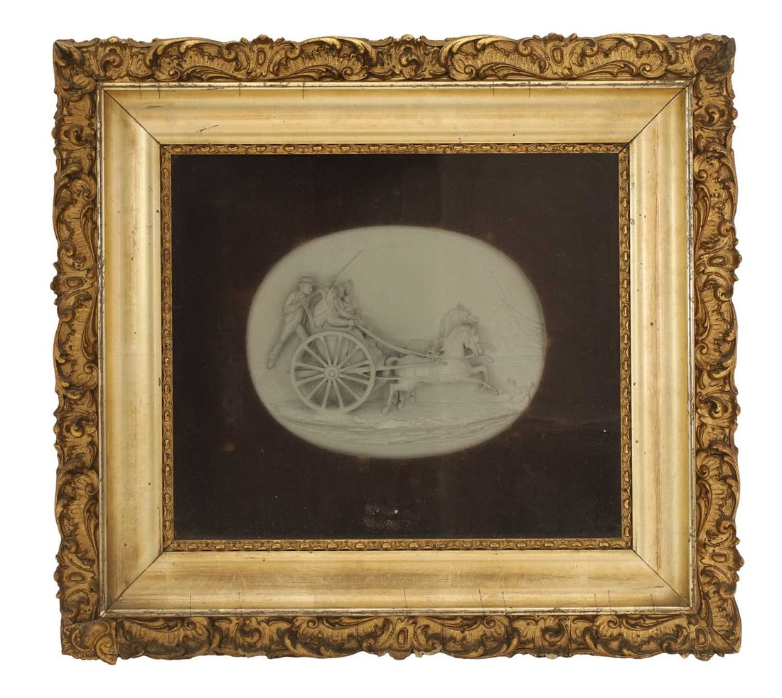 A composite relief plaque,: A composite relief plaque, the relief oval plaque depicting a family fleeing the erupting Mount Etna on a carriage pulled by horses, in gilded frame Plaque, 19cm wide, 14cm high, framed, 44cm wide,