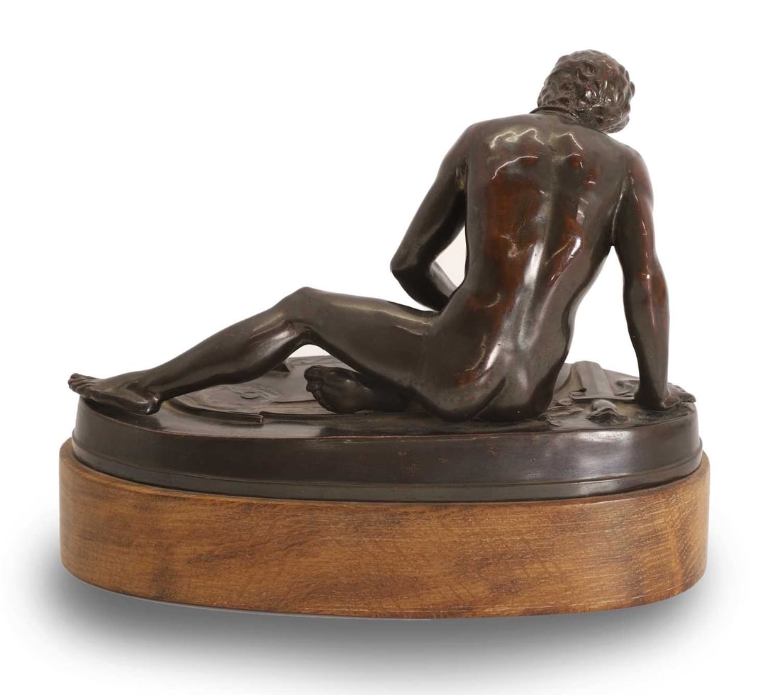 A pressed bronzed tin figure, 20th century, - 2