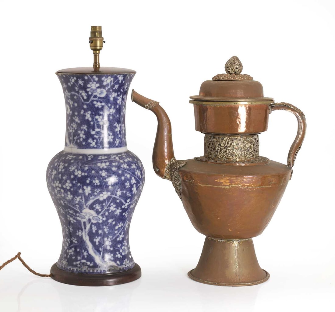 A copper Tibetan ewer,: A copper Tibetan ewer, of large scale, with metal-mounted decoration, together with a blue crackled ice and prunus blossom vase, converted into a lamp, with round wooden base Ewer, 40cm wide, 50cm