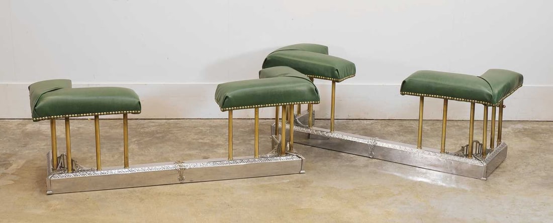A pair of chrome club fenders, of modern manufacture,: A pair of chrome club fenders, of modern manufacture, both upholstered in green vinyl with chrome mounted details ot the frames 126cm wide, 44cm deep, 49cm high 2
