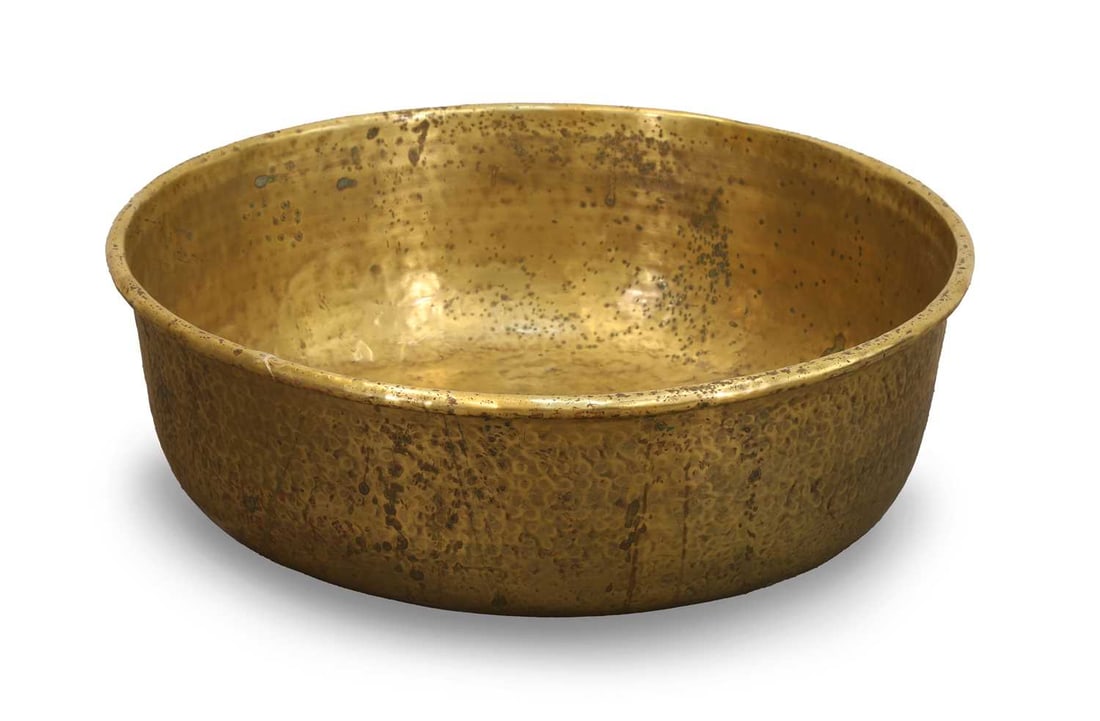 Hammered brass log bin, early 20th century,: Hammered brass log bin, early 20th century, with planished surface and copper studs to the base 74cm wide, 23cm high Condition Report: Some tarnishing and wear. Marks and scratches throughout