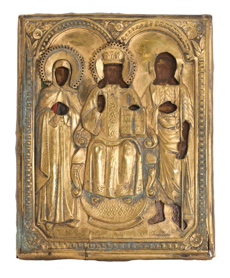 An icon of The Holy Family, 19th century, Balkans,: An icon of The Holy Family, 19th century, Balkans, depicting Christ seated, flanked by The Mother of God and Saint Joseph, with a gilt-brass oklad 33cm wide, 27cm high Condition Report: The Oklad is