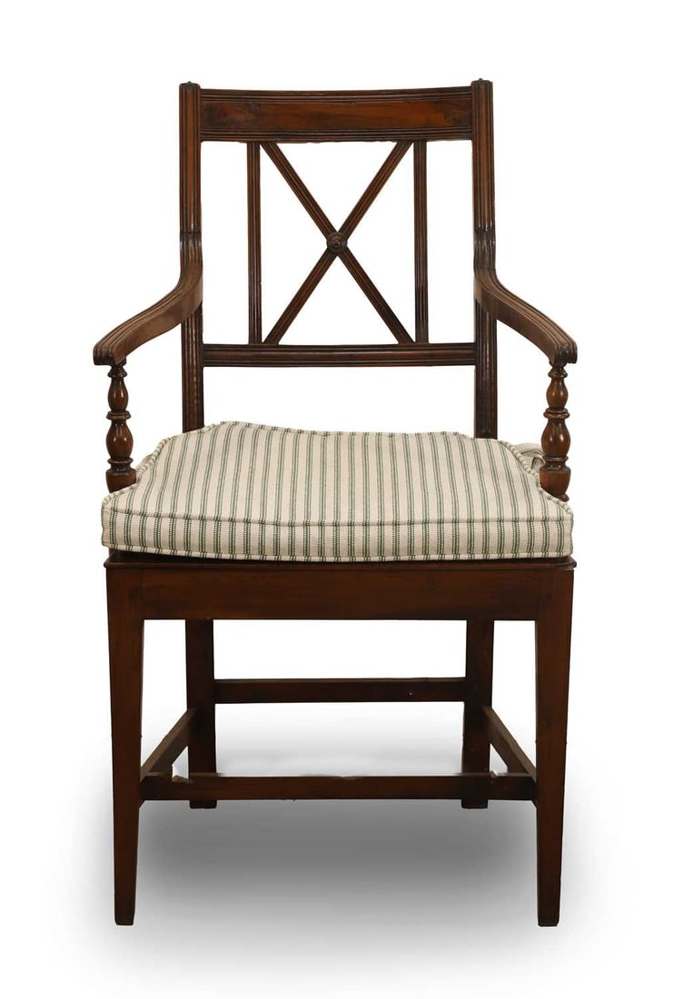 A vernacular Regency yew elbow chair, early 19th century,: A vernacular Regency yew elbow chair, early 19th century, the X-shaped splat above two shaped and reeded arms, with tapering square supports 55.5cm wide, 42cm deep, 97cm high Condition Report: Two