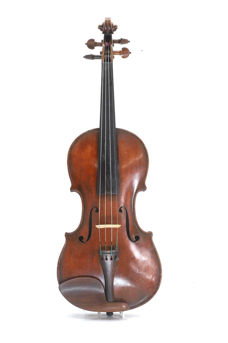 A violin,: A violin, probably late 19th Century, labelled 'Giofreddo Cappa...16??', with a coffee coloured finish, the two piece back measuring 357mm, with modern fitted case Condition Report: Extensive cracks r